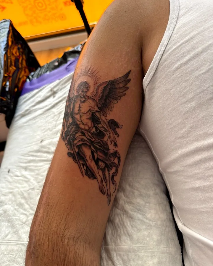 Black and grey angel tattoo by Tinta Libre Tattoo in Calella