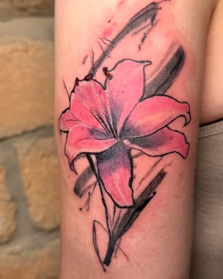 Color lily tattoo by Tinta Libre Tattoo in Calella